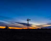 farm windmill in a sunset